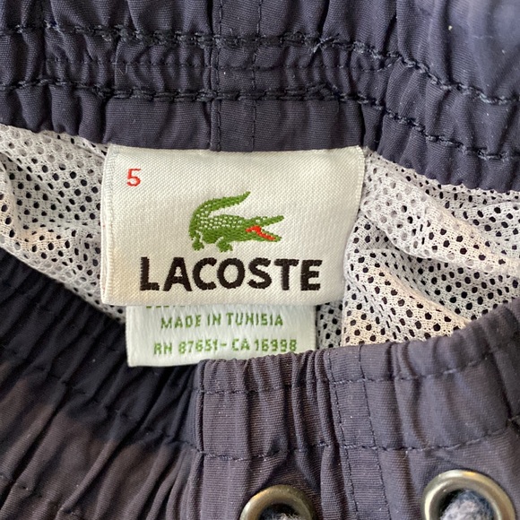 A Lacoste men’s quick-dry swim shorts with built in mesh lining. - Picture 4 of 8